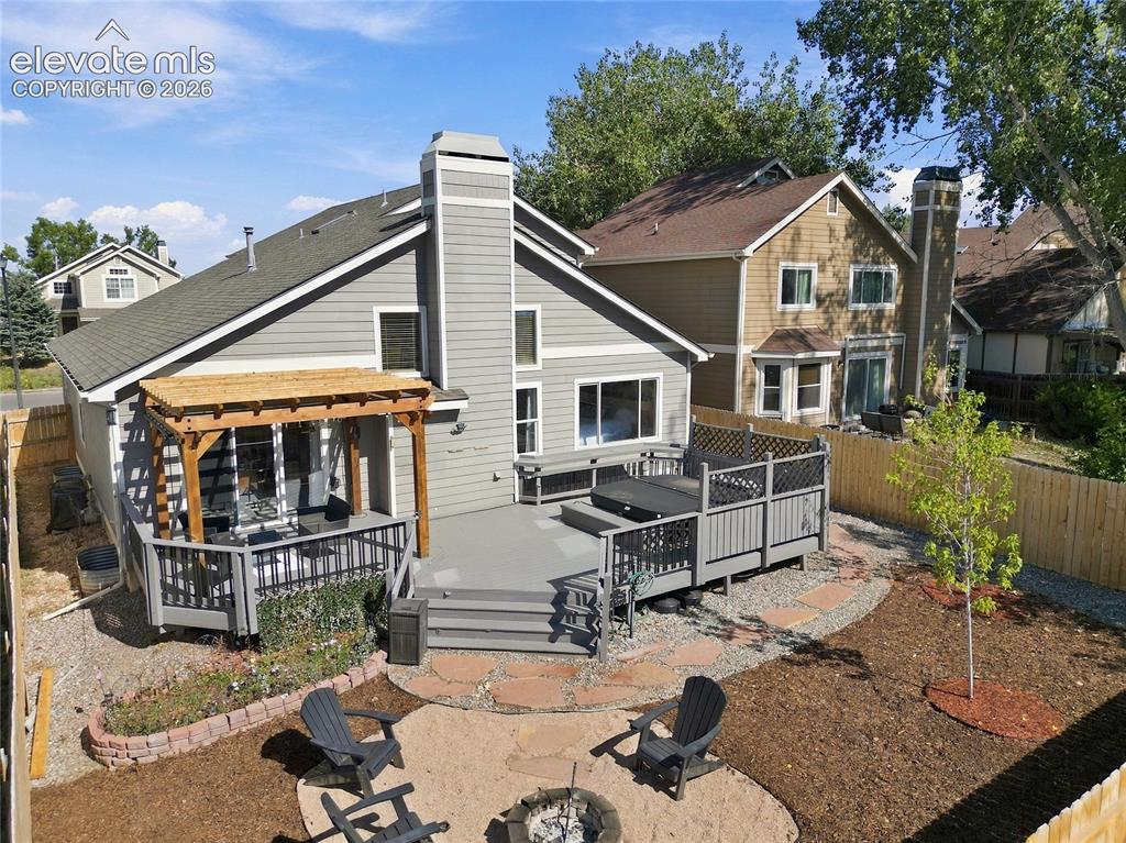 Image 37 of 45: Charming home featuring a light gray exterior with modern siding and a peak