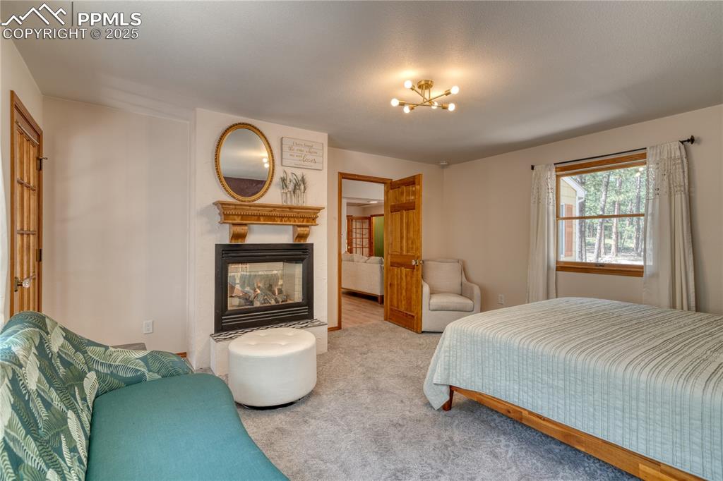 Image 15 of 50: Main level master bedroom