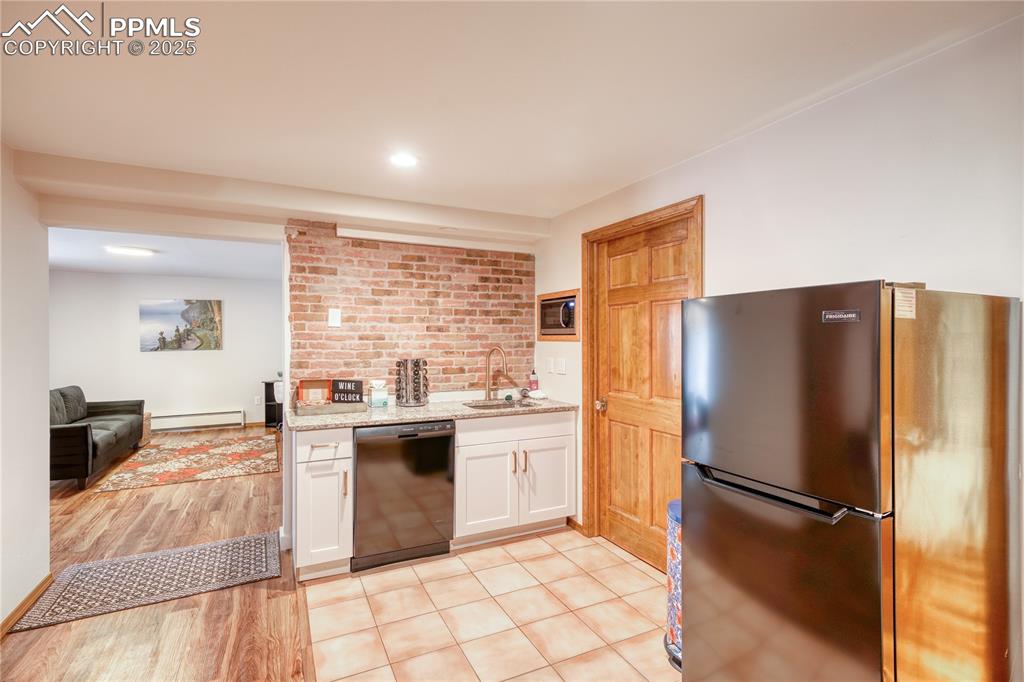 Image 23 of 50: Second kitchen in basement