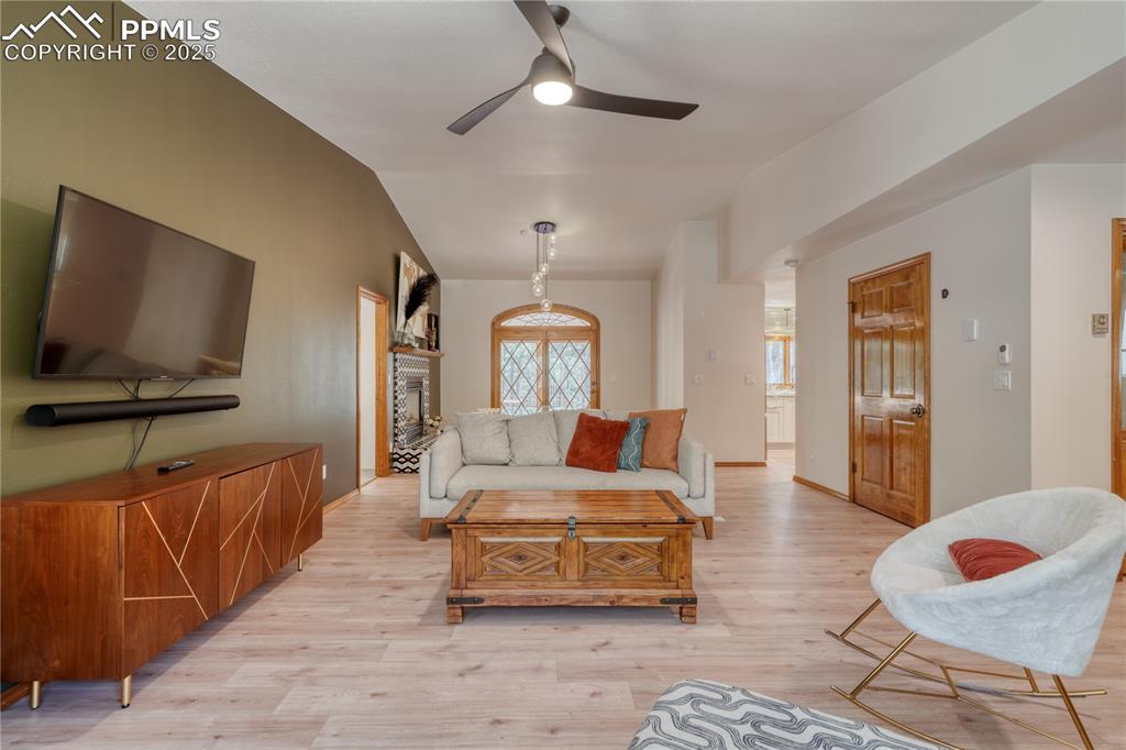 Image 9 of 50: Living area with lofted ceiling
