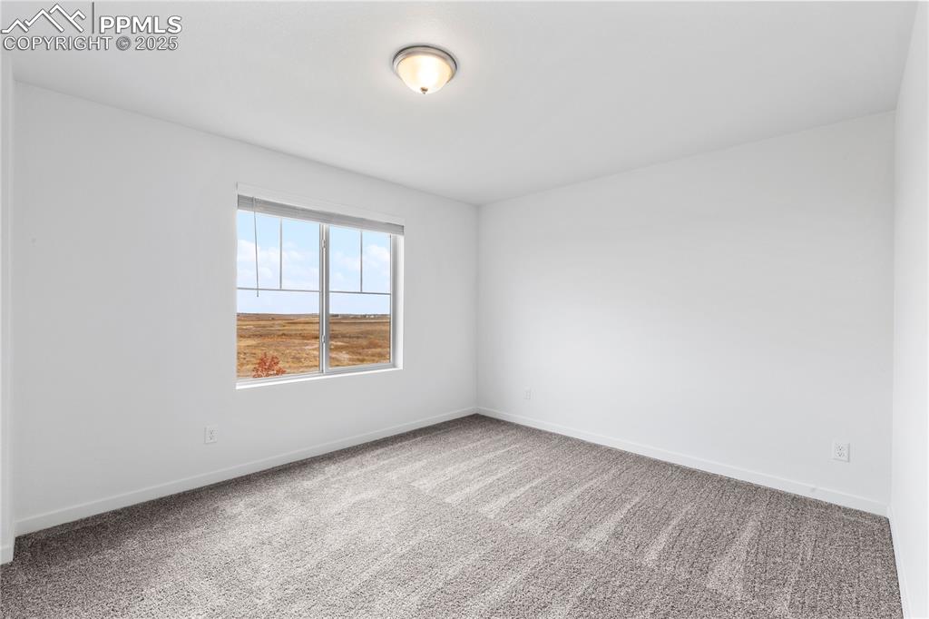 Image 16 of 39: Huge office has a window facing South for lots of natural light