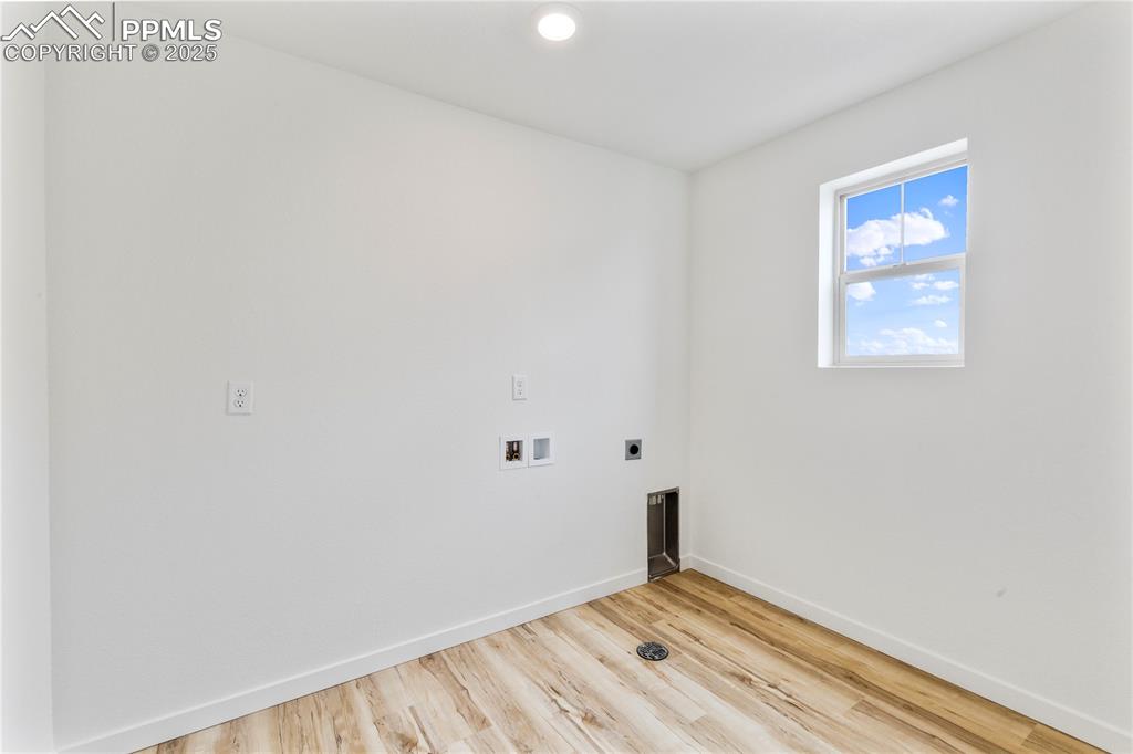 Image 19 of 39: Separate laundry room on second floor