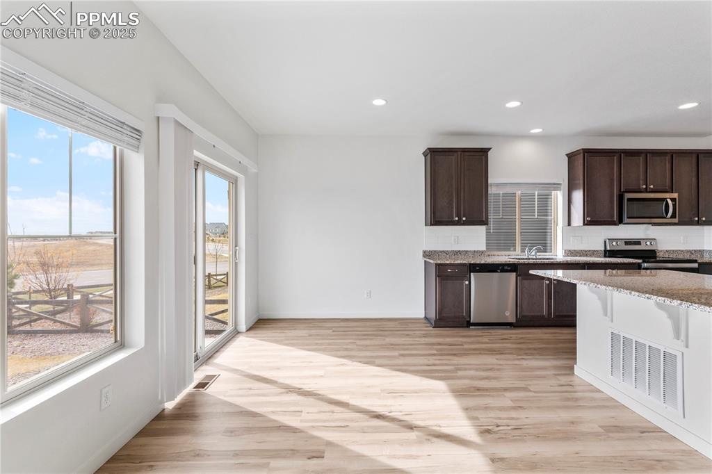 Image 9 of 39: Dining area walks out to the back yard