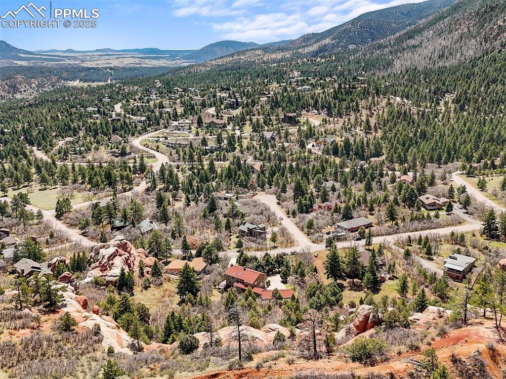 Image 43 of 49: Drone / aerial view with a forest view and a mountain view