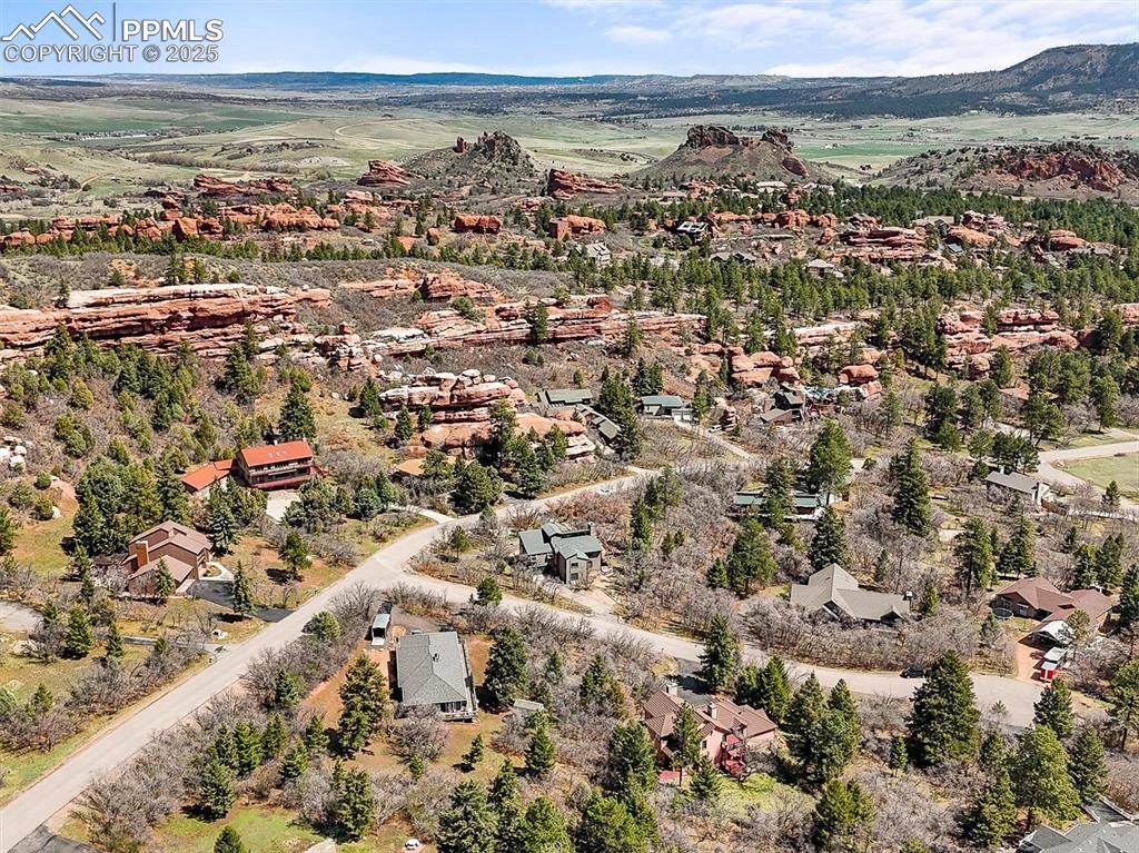 Image 47 of 49: Birds eye view of property with a mountain view