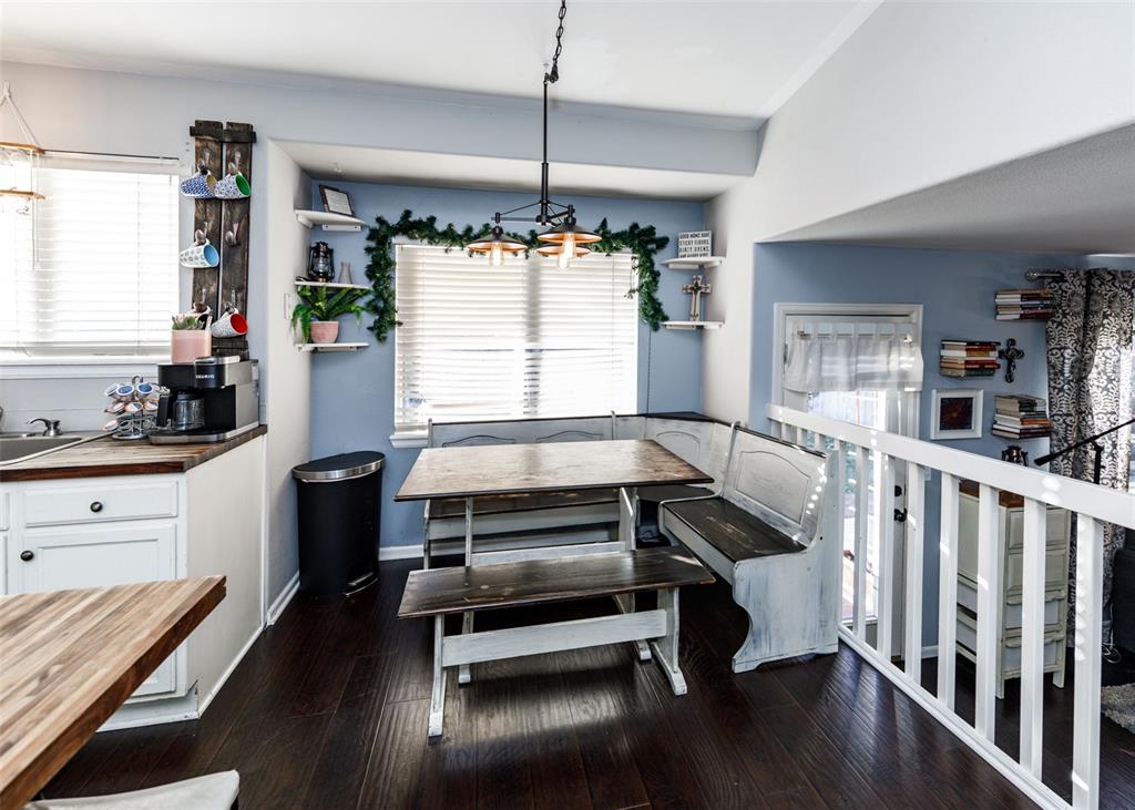 Image 17 of 42: Dining area featuring dark wood finished floors and breakfast area
