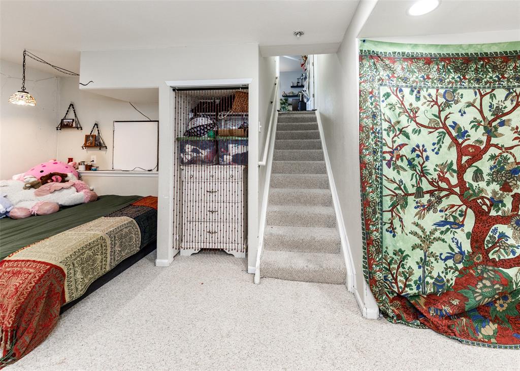 Image 27 of 42: Carpeted bedroom with baseboards
