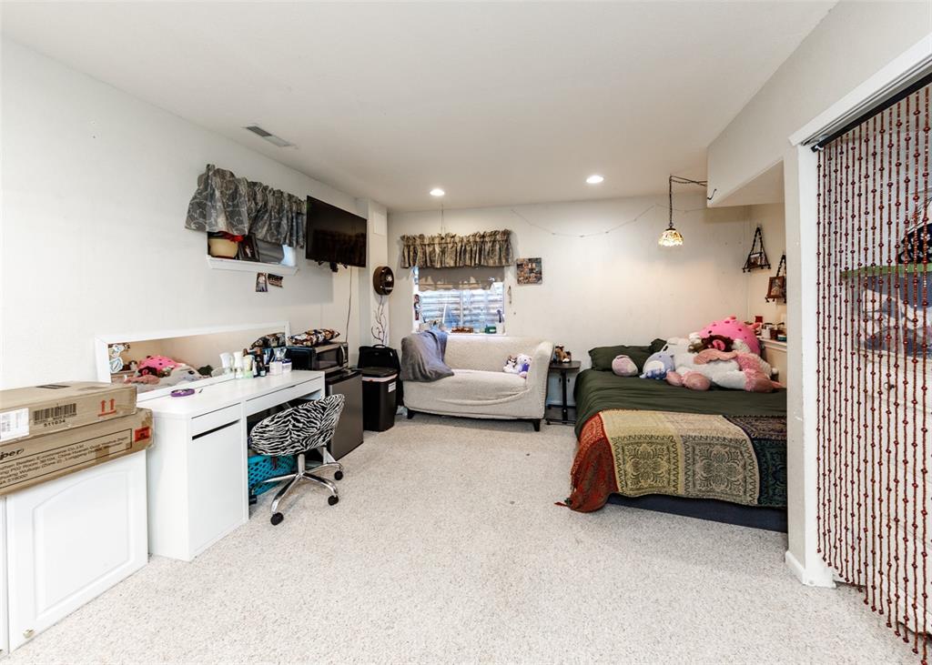 Image 28 of 42: Bedroom featuring light colored carpet and recessed lighting
