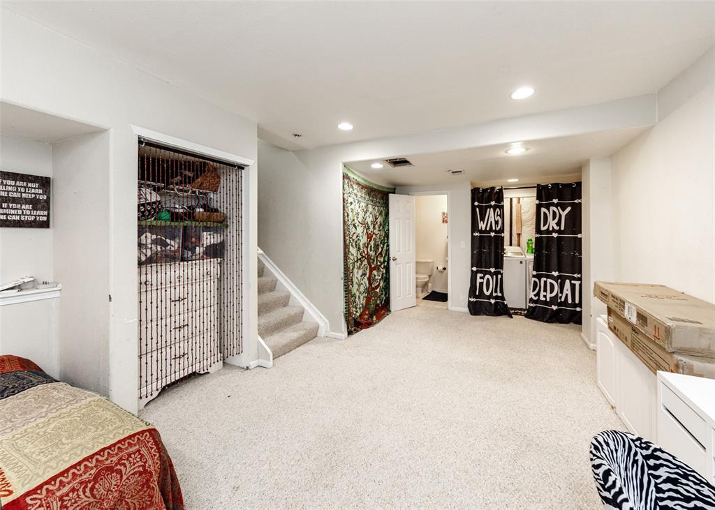 Image 29 of 42: Bedroom with light carpet and recessed lighting