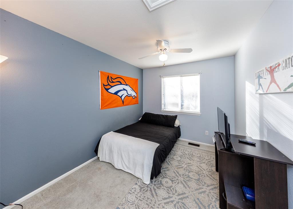 Image 39 of 42: Bedroom featuring light carpet and ceiling fan