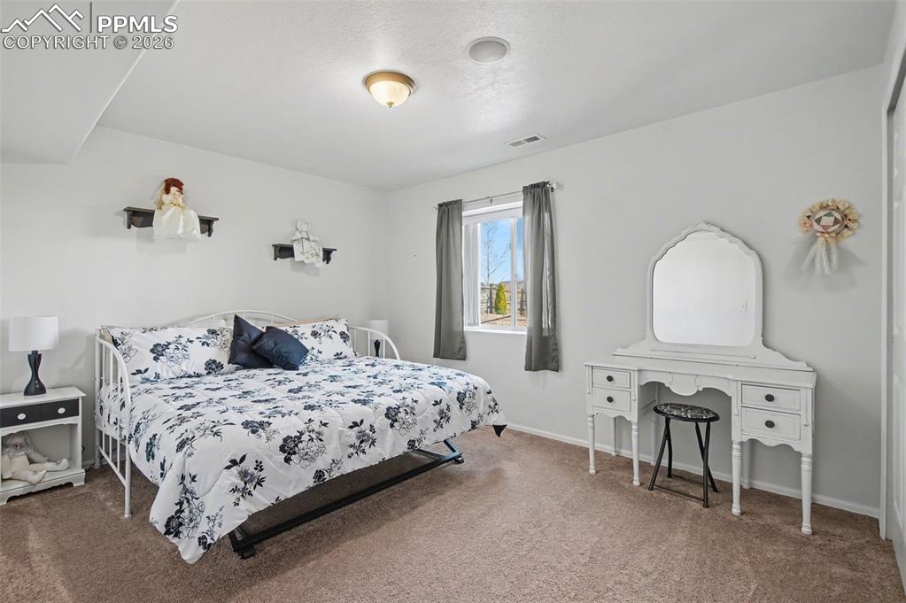 Image 35 of 48: Basement Bedroom