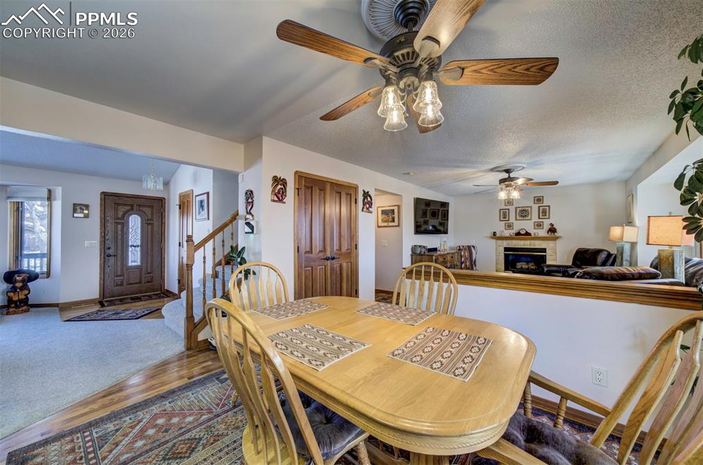 Image 12 of 38: View of front door, stairs to upper level, living and family rooms