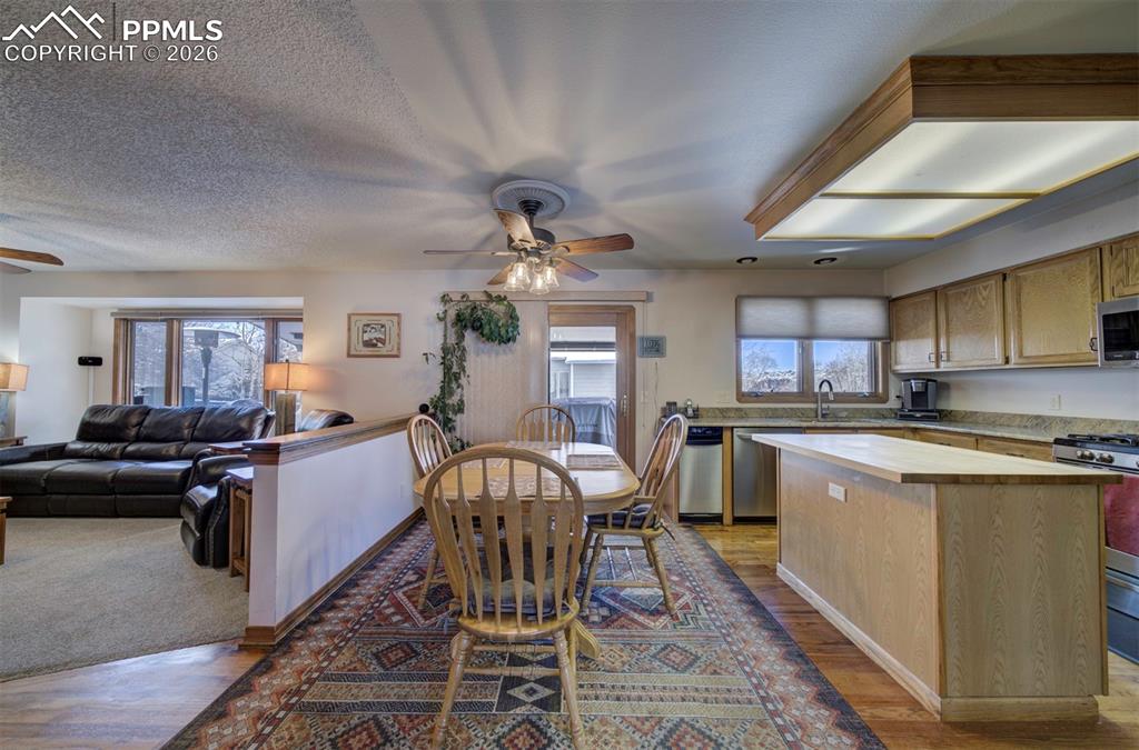 Image 13 of 38: View of dinning area, kitchen, and family room