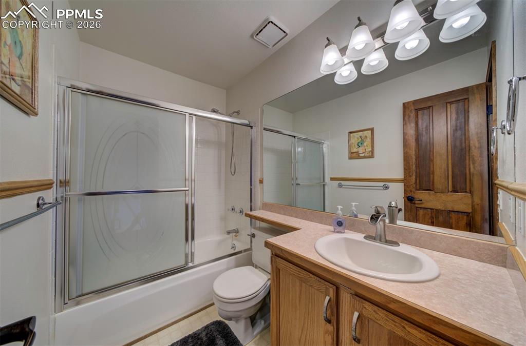 Image 27 of 38: Full bath, tub/shower combo on upper level for bedrooms 2 & 3