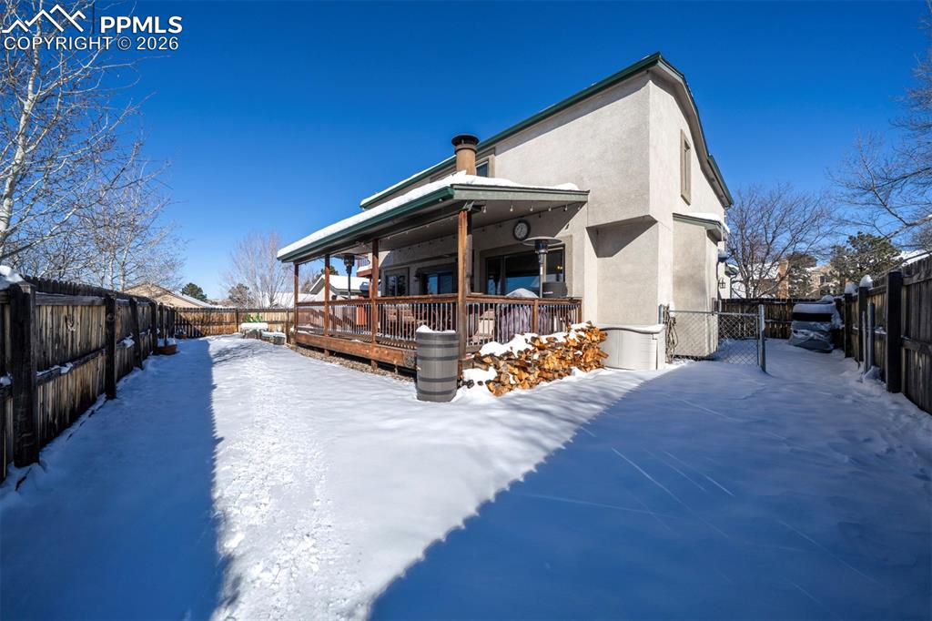Image 33 of 38: Backyard with run, covered patio, and shed