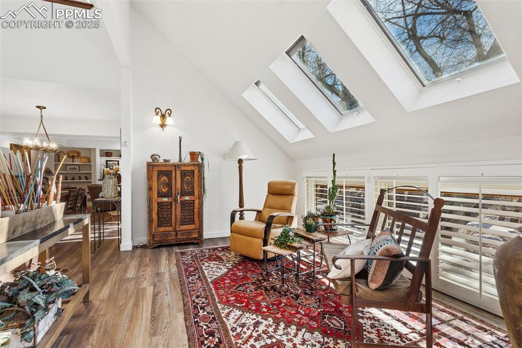 Image 13 of 46: Solarium lets the light in from the multiple skylights