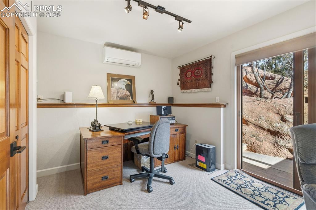 Image 25 of 46: Part of the bedroom is used as office space