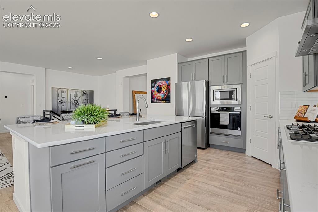Image 12 of 44: Large kitchen island perfect to gather around.