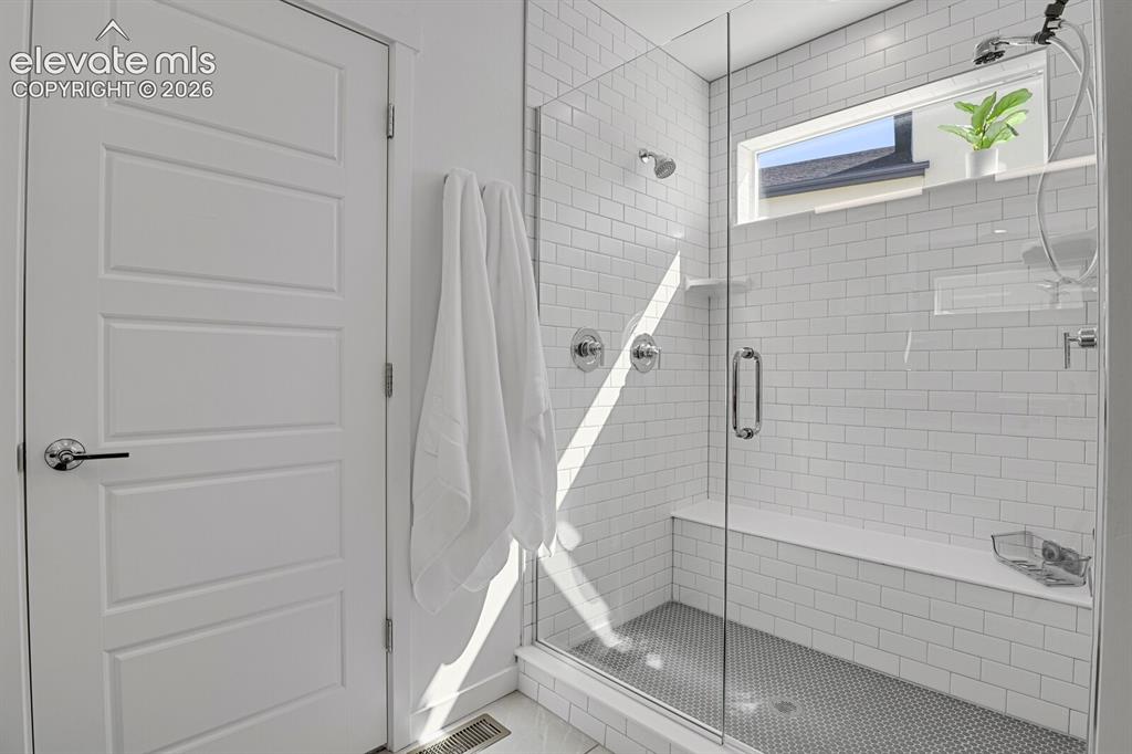 Image 24 of 44: Oversize shower with bench,