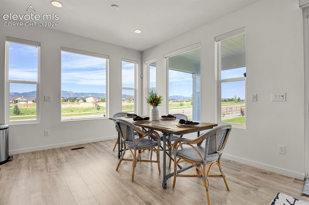 Image 3 of 44: Lots of windows letting in the natural light and the amazing front range vi