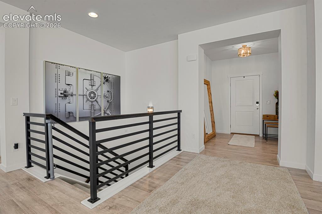 Image 9 of 44: Black metal railings really give this level a modern look and feel.
