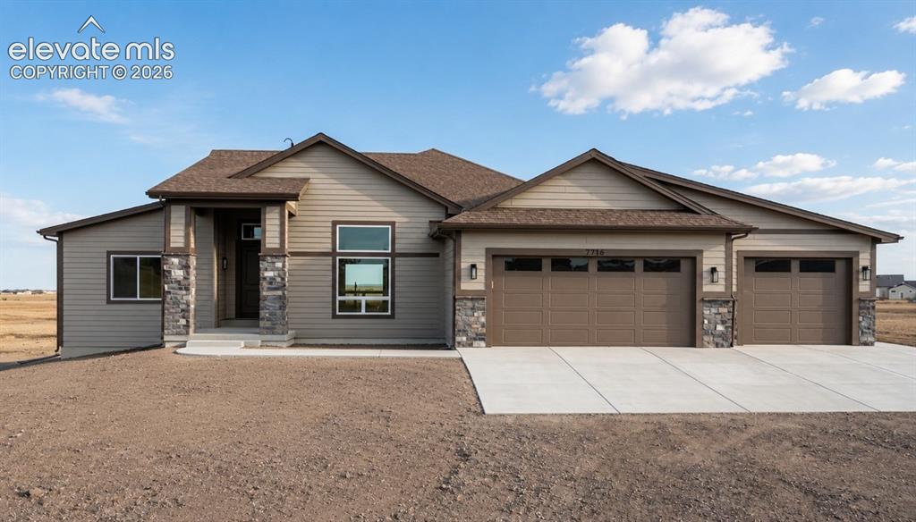 Caption: Ranch-style exterior with stone accents and horizontal siding
