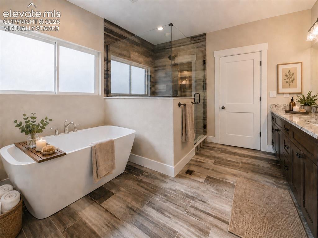 Image 22 of 40: Virtually Staged Freestanding tub with dual windows, glass-enclosed shower 