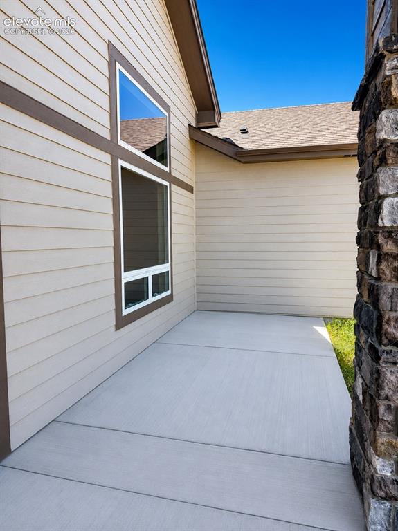 Image 5 of 40: Exterior siding in a neutral tone with contrasting trim