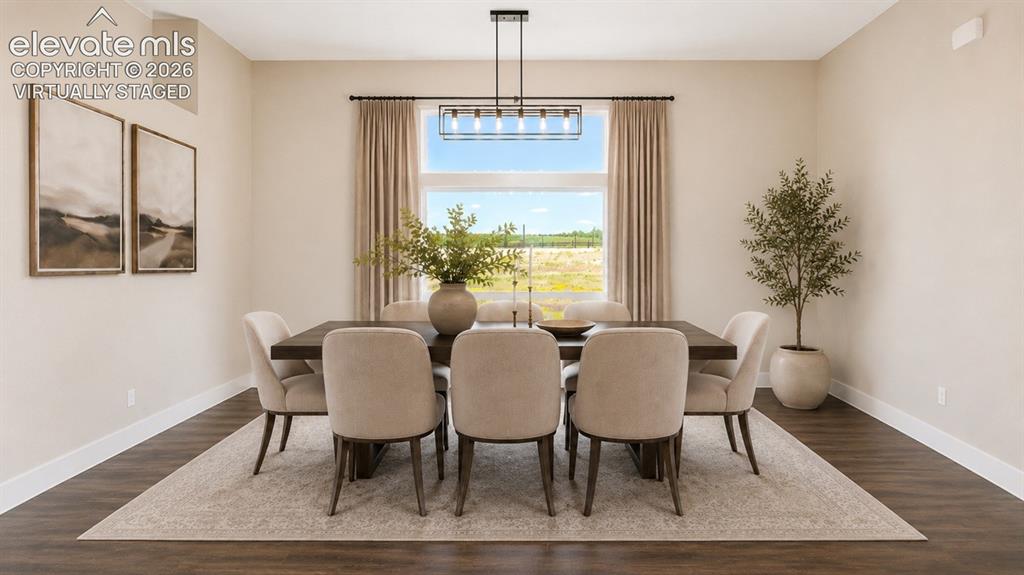 Image 8 of 40: Virtually Staged Dining area featuring a contemporary linear chandelier, la