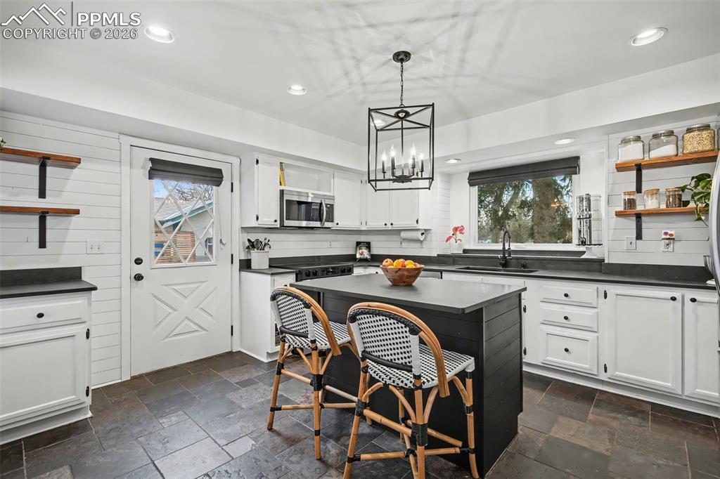 Image 14 of 37: Stone Floor convenient walk out