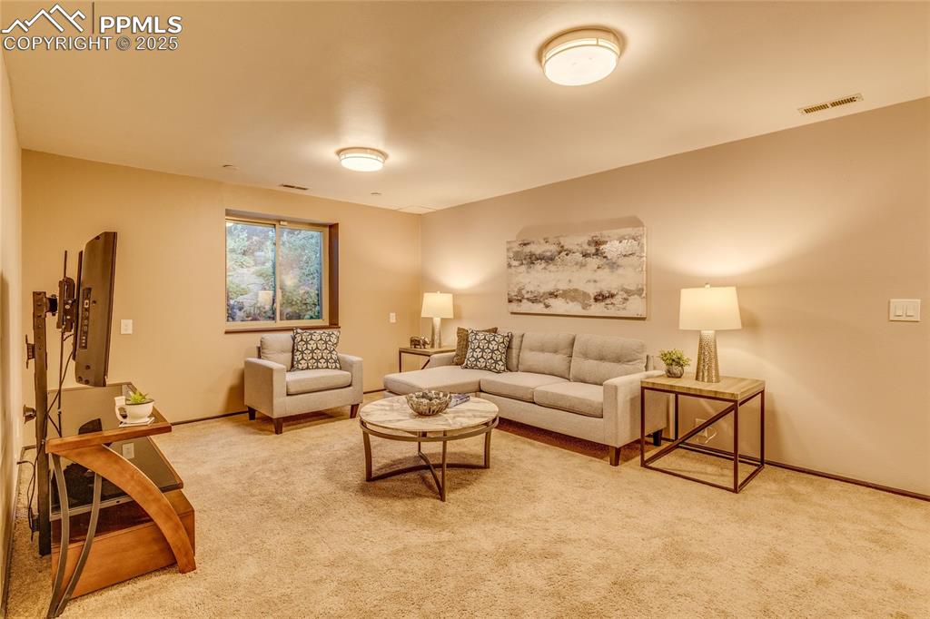 Image 14 of 31: Basement den area, great get away for adults or kids