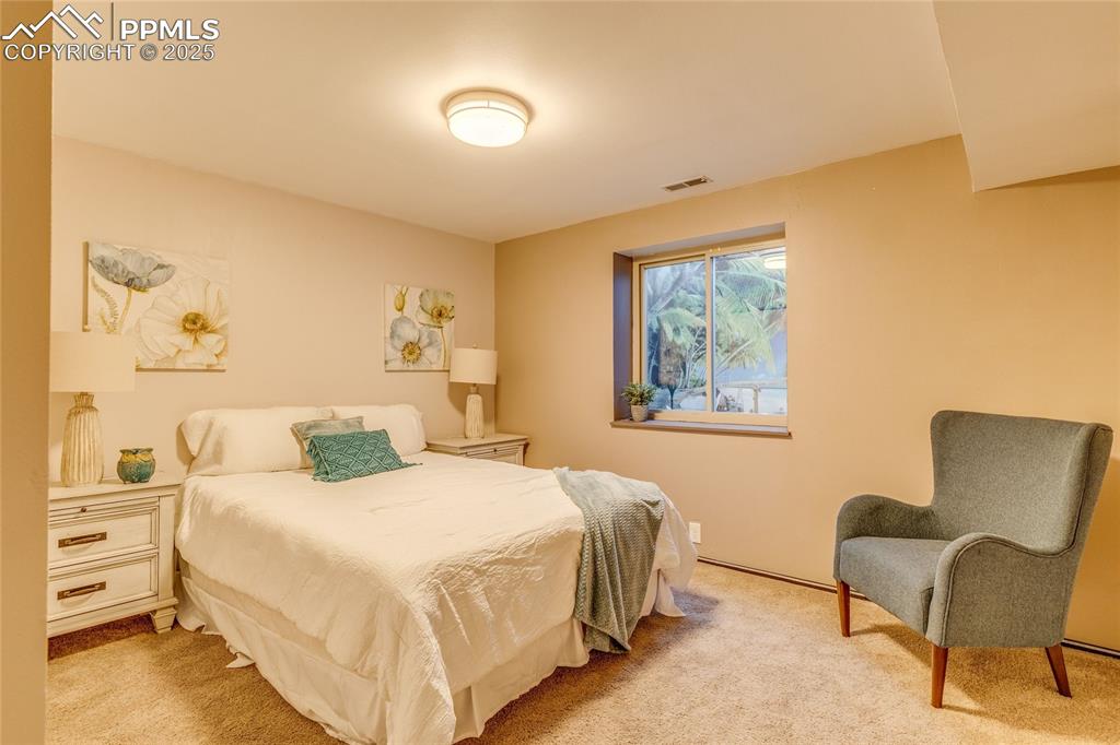 Image 16 of 31: Basement bedroom, great bedroom for a family member or a guest sanctuary