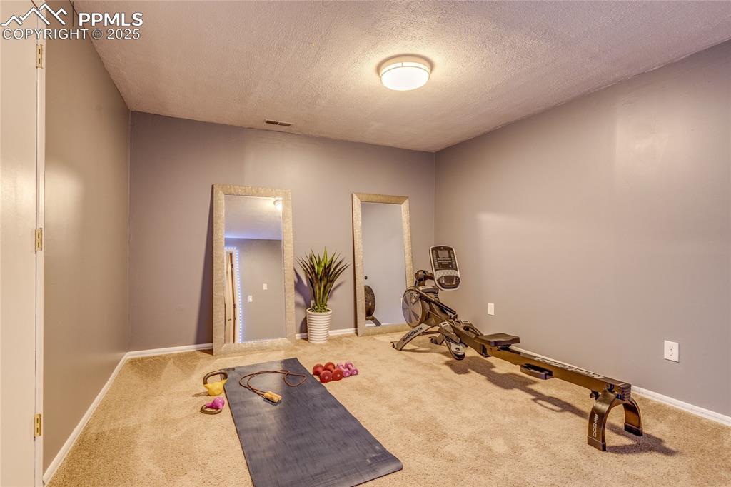 Image 20 of 31: Basement exercise room or make it into a movie room or dark room, no window