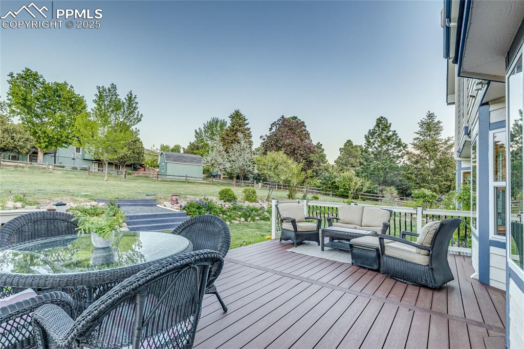 Image 23 of 31: Composite deck off the back, great hangout and outdoor dining