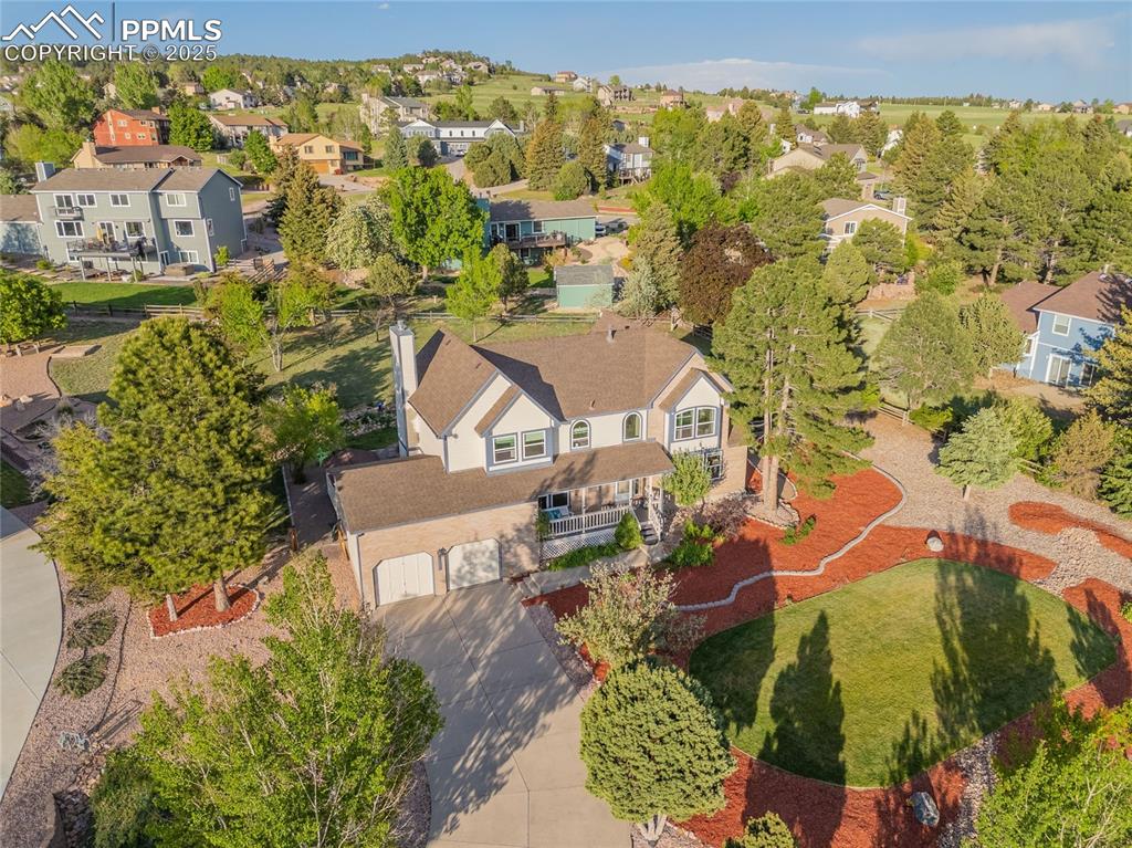 Image 28 of 31: Aerial perspective of home, lots of it is zeroscaped to make it easy to mai