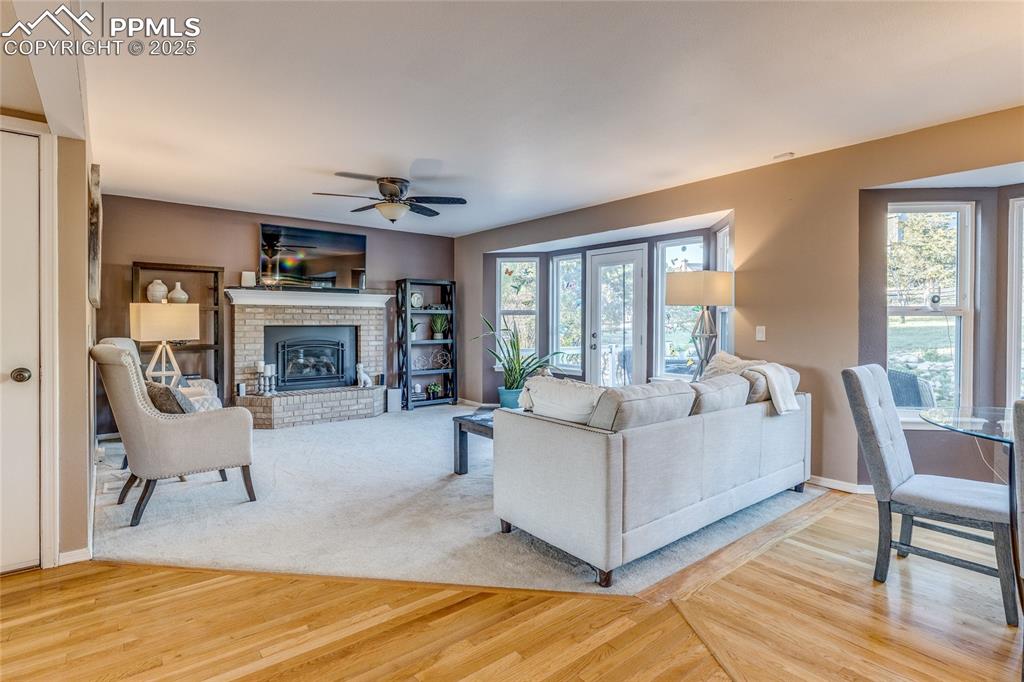 Image 6 of 31: Family Room with gas fireplace and with door to your back yard Oasis
