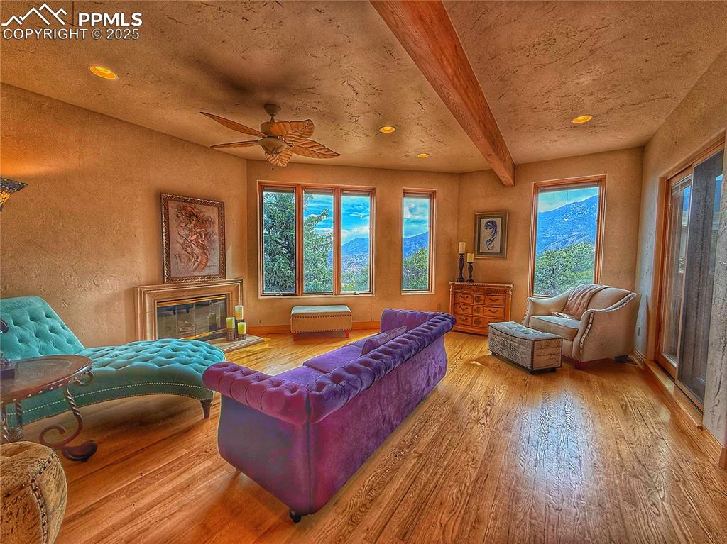 Image 13 of 20: Office/studio with gas fireplace and walk out to patio.