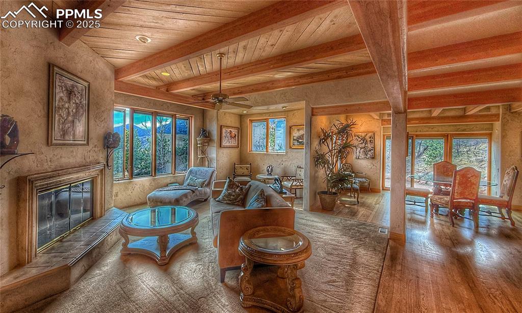 Image 3 of 20: Living room with hard wood flooring, a wealth of natural light, a premium f