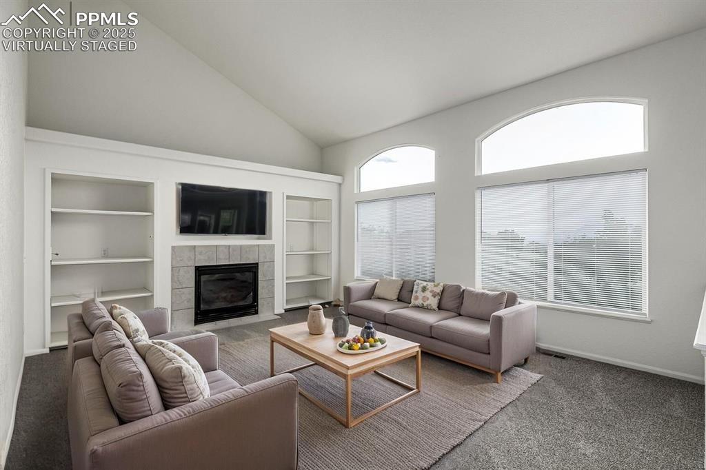 Image 12 of 35: Enjoy the secondary main level living space off of the dining nook and kitc