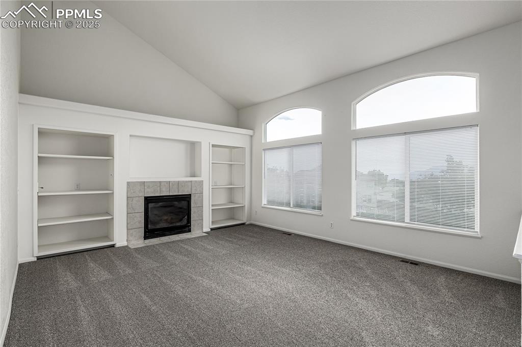 Image 13 of 35: Enjoy the secondary main level living space off of the dining nook and kitc