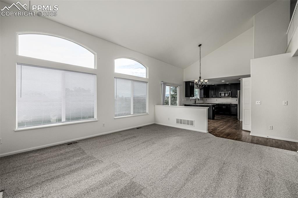 Image 15 of 35: Enjoy the secondary main level living space off of the dining nook and kitc