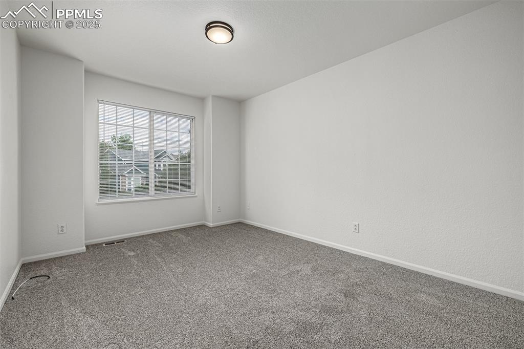 Image 21 of 35: Upstairs Secondary Bedroom