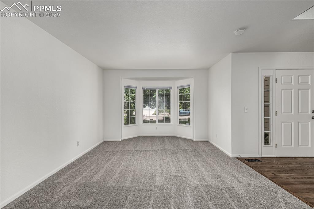 Image 4 of 35: The formal living room is perfect for entertaining