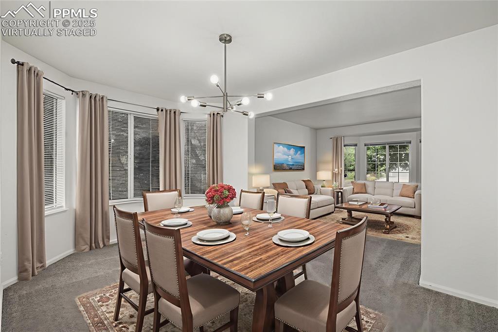 Image 5 of 35: The formal dining room is a wonderful space for hosting holidays. VIRTUALLY