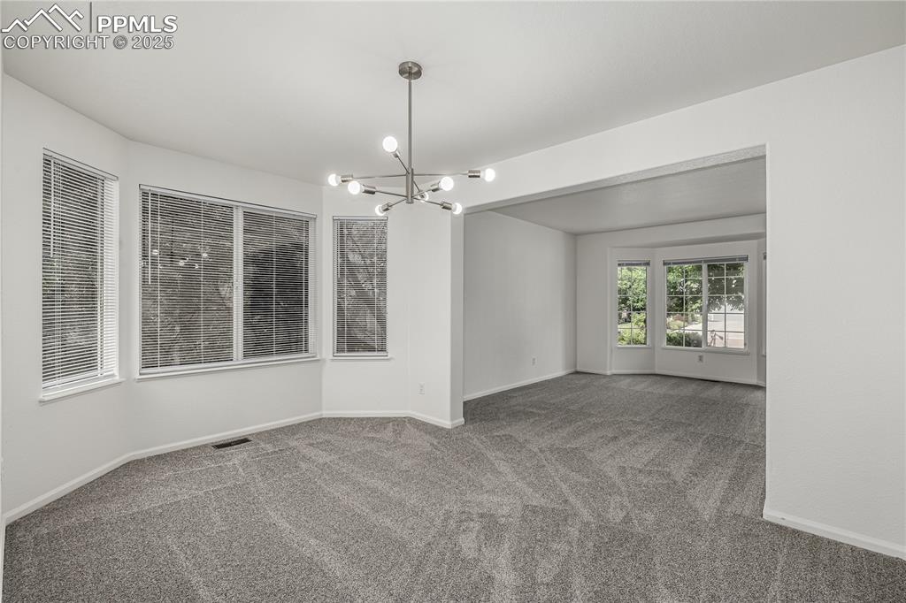 Image 6 of 35: The formal dining room is a wonderful space for hosting holidays.