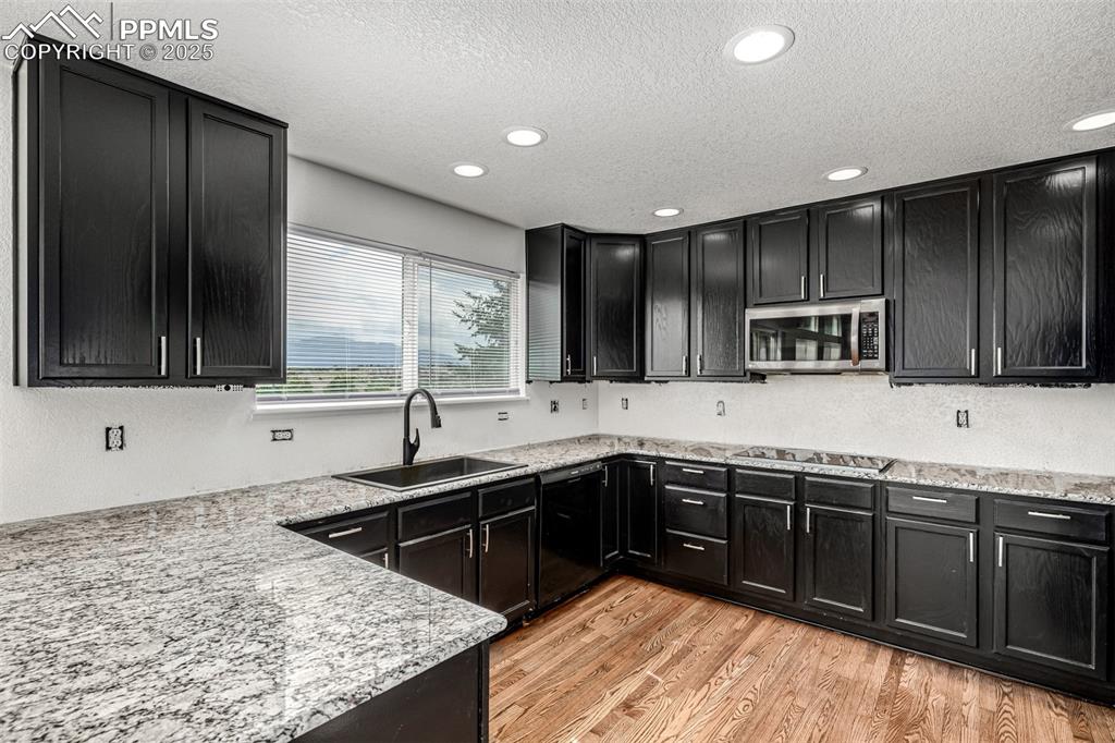 Image 8 of 35: With all new granite countertops and a soon to shine backsplash. 