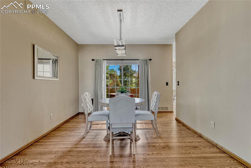 Image 22 of 48: Formal dining room provides a walk-out to back patio