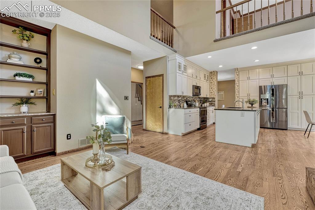 Image 27 of 48: Great built-in storage with quartzite counter!