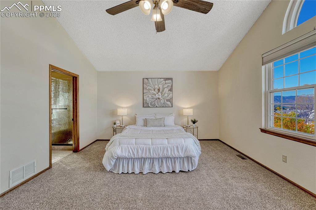 Image 30 of 48: Primary bedroom with adjoining 5-piece bath