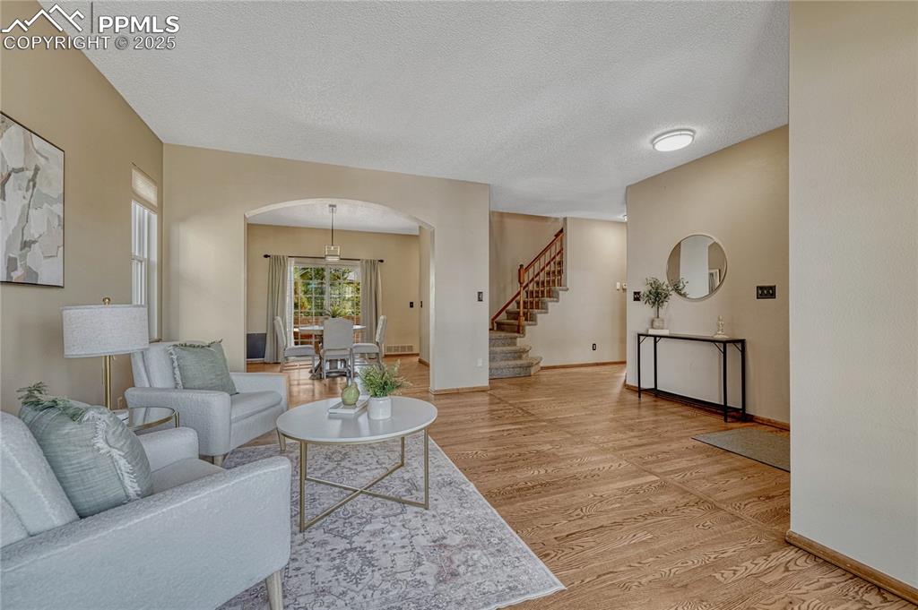 Image 4 of 48: Hardwood flooring continues through most of the main level